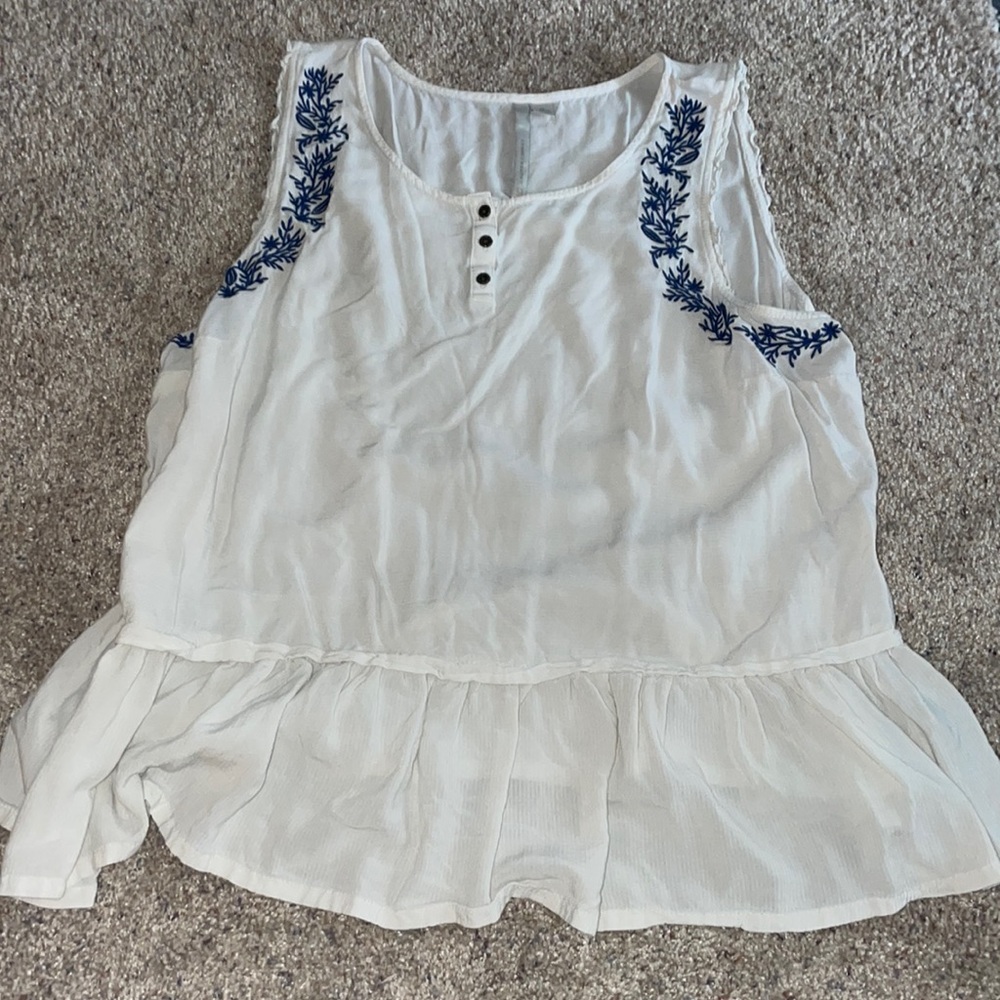 white tank top, no stains. flares at the bottom a bit